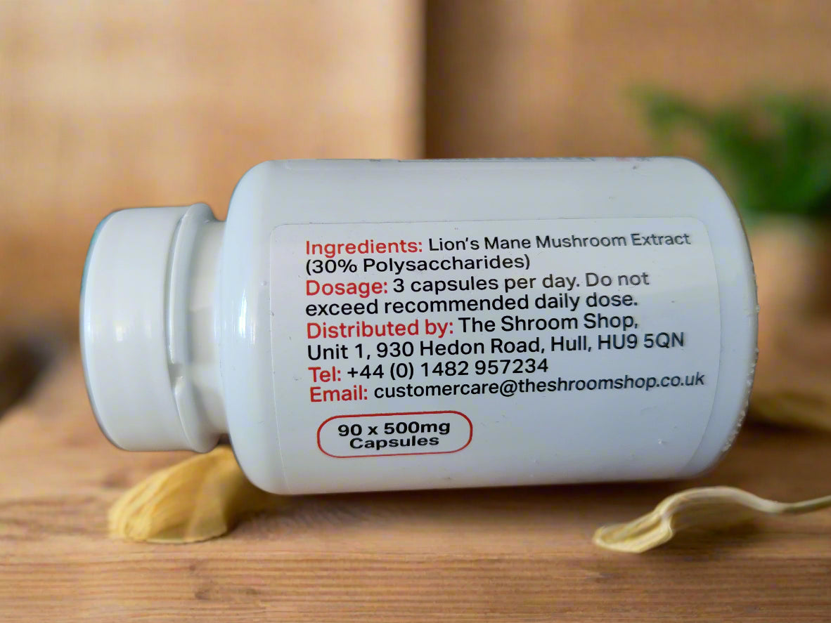 White supplement bottle with black text ingredients on a wooden surface