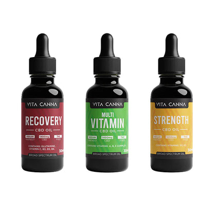 Three bottles of Vita Canna CBD Oil on a white background