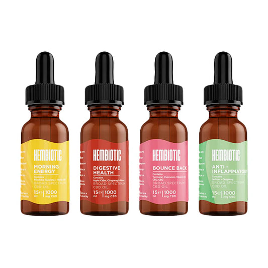 Four bottles of Hemibiotic CBD products with colorful labels on a white background